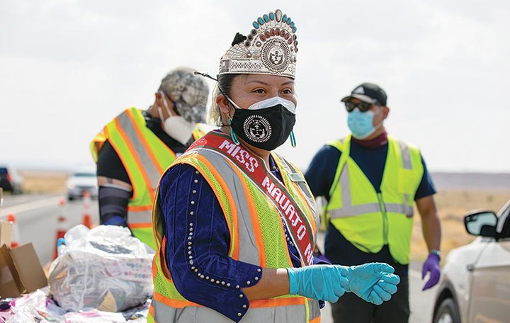 Sharon Chischilly for Navajo Times Miss Navajo Nation Shaandiin Parrish helps distribute homemade facemasks and hand sanitizer to families in vehicles on Aug. 20 in Chinle